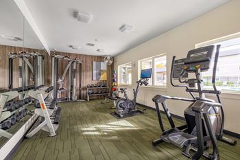 Fitness center with free weights, and cardio machines, open 24/7 for your convenience